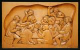 Bas-relief (Sept hommes fêtant à table)