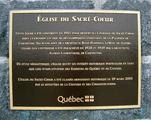 Plaque de l'église du Sacré-Coeur. Vue avant