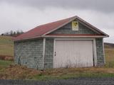 60, 3e Rang Est (avec garages). Garage 2. Vue avant