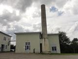 Centre prière et paix et ateliers. Chaufferie. Vue avant