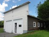 387, route 277 (avec garage). Garage. Vue avant
