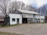 160, 1e Rang Est (avec remise, hangar et cabane à sucre). Hangar avec remise et garage en annexe. Vue avant