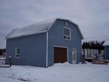 408, route 132. Garage. Vue avant