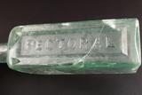 Bouteille à médicament. Détail de l'inscription «PECTORAL»