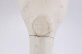 Pipe. Détail de la marque sous le talon