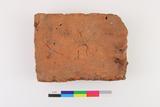 Fragment de brique. Face A