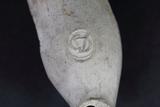 Fourneau de pipe. Détail marque, côté proximal du fourneau