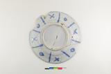 Assiette. Dessous