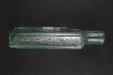Bouteille à sirop. Détail de l'inscription « SIROP DUBOIS »