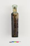 Bouteille à médicament. Côté