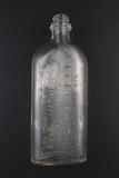 Bouteille à sirop. Détail de l'inscription côté français
