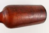 Bouteille à bouillon de boeuf. Détail de l'inscription «FLUID BEEF»