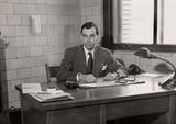 Frégault, Guy. Guy Frégault, historien et professeur, à son bureau au département d'histoire de l'Université de Montréal, vers 1945.